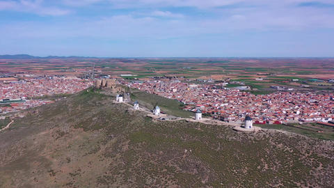 Aerial View of Consuegra Windmills with Historic Town in Background – Iconic Travel Destination