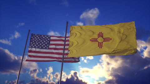 United States and New Mexico Flags Waving Against Dramatic Sunset Sky