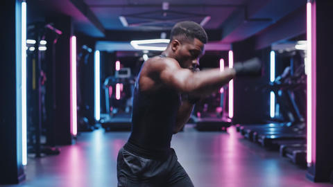 Boxer training in gym with neon lights