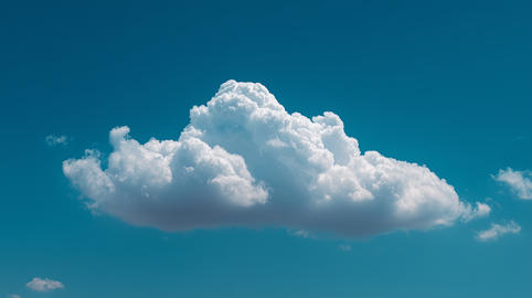 Majestic White Cumulus Cloud in a Vibrant Summer Blue Sky