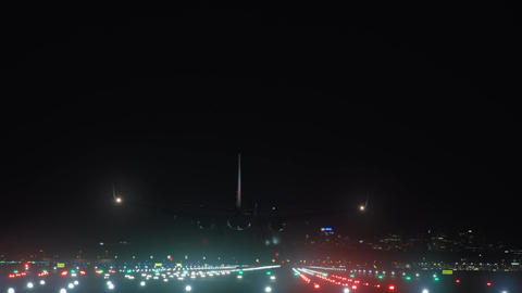Aircraft landing at night rear silhouette navigation lights