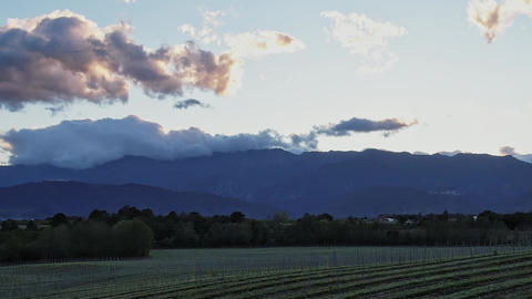 View of mountains and fields in Corsica during sunset