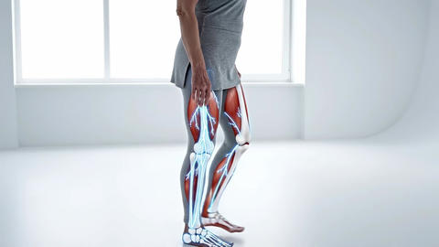 Woman shifting weight from one leg to the other in a bright studio space, lower body muscles and