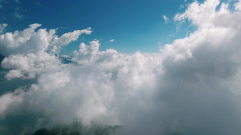 Aerial view above the sea of ​​clouds with the sunset