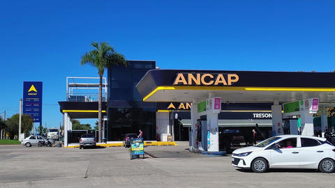 Long static side view video of gas station in montevideo