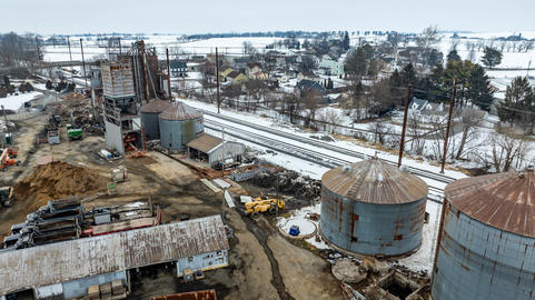 Construction Site With Silos and Fields in the Background During Winter