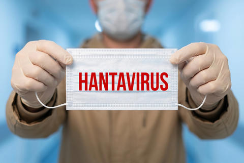 Medical professional displaying hantavirus warning on face mask
