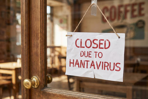 Closed due to hantavirus sign on storefront door glass