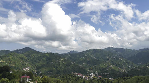 Time Lapse Footage of Villages, Green Tea Fields and Cumulus Clouds