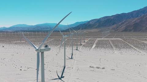 Drone aerial panorama of desert windmills and mountain landscape near Palm Springs California under