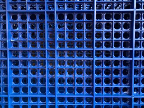 blue plastic crate used for carrying vegetables to fresh markets