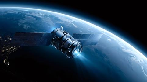 Communication satellite orbiting earth sending data signal