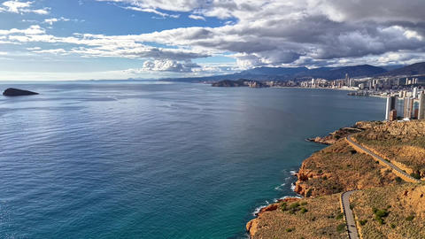 Scenic Coastal Panorama. Picturesque Coastal Route Overlooking Vibrant Turquoise Waters And Distant