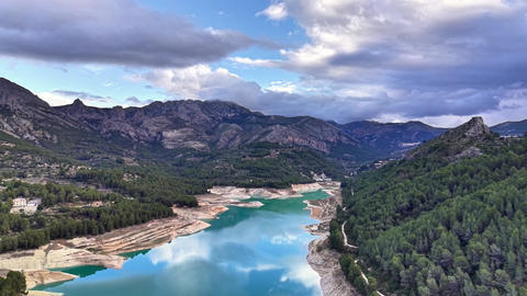 Vivid Mountain Scenery. Geologists Study Shoreline And Sediment Layers Beside Tranquil Reflective
