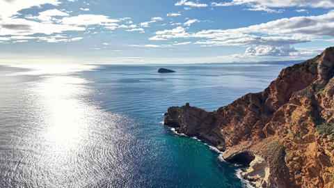 Peaceful Coastal Panorama Highlighting Rugged Promontories And Shimmering Pathways On Sea Surface