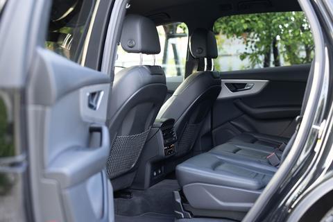 Leather rear seats with seats belt. Modern hybrid MHEV car interior. Rear passenger seats electric