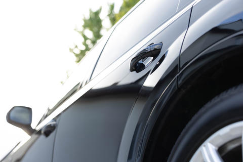 Keyless entry car door handle with keyless go touch sensor. Automatic opening of a car door without