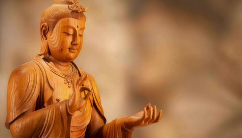 Wooden statue of Fugen Bodhisattva, close-up, blurred background and copy space