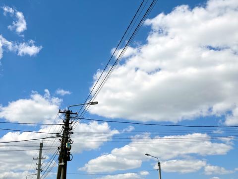 Electricity Poles and Wires Under Blue Sky With Clouds in Afternoon
