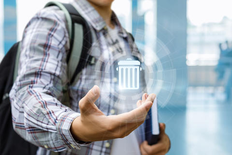 Student with e-trash can
