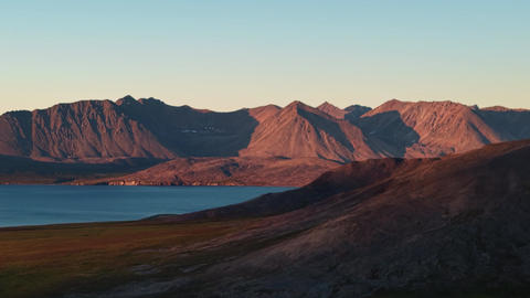 Aerial flyover tracking past rugged peaks at Gilmimyul Bay Provideniya Chukotka