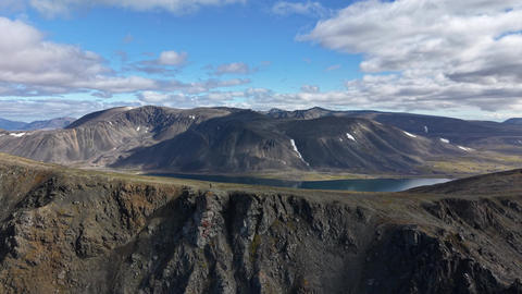 Top View drone glide along rocky ridge and bay near Provideniya Chukotka