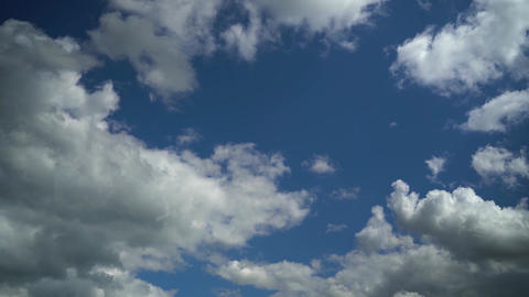 White Cumulus Clouds In Blue Sky