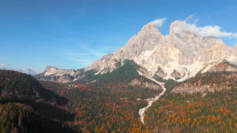 Aerial view of high mountain range with clouds in Dolomites, Italy