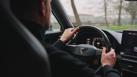 Man driving car through the streets of the city