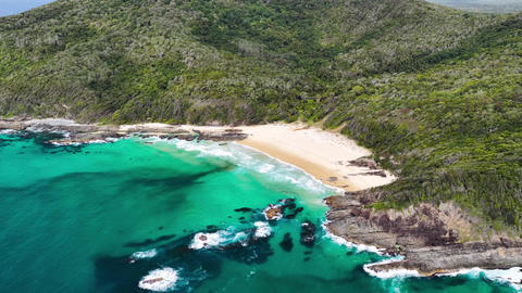 Aerial video panning around McBrides Beach near Forster, NSW, Australia