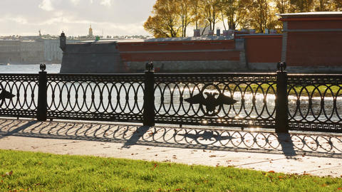 picturesque metal railings with a double-headed eagle and the crown of the