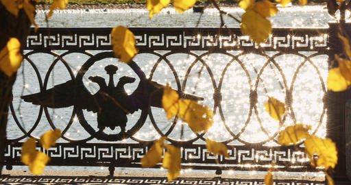 picturesque metal railings with a double-headed eagle and the crown of the
