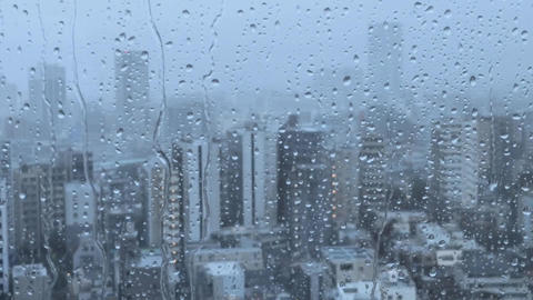 Raindrops falling from the window