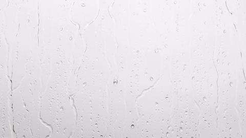 Raindrops falling from the window