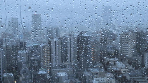 Raindrops falling from the window