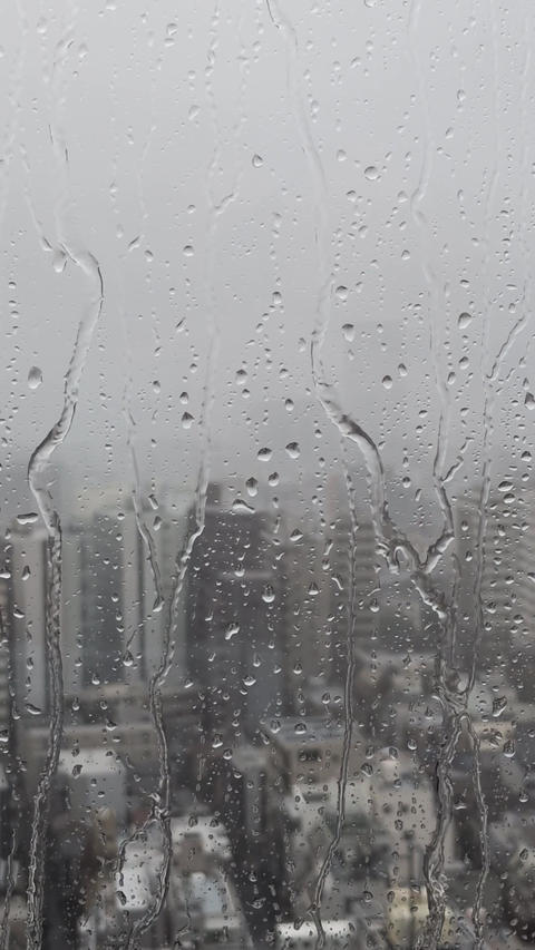 Raindrops falling from the window