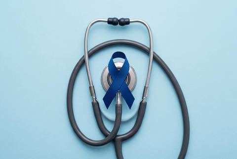 Blue prostate cancer awareness ribbon and stethoscope