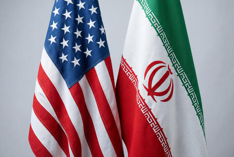 National flags of the united states and iran placed side by side