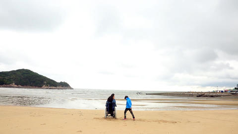 Color Shot of Mother and Son at Beach (Time-lapse)