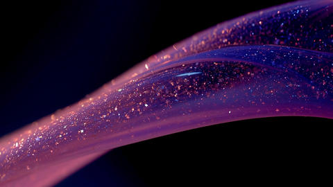 Shimmering glitter gel flowing on black background