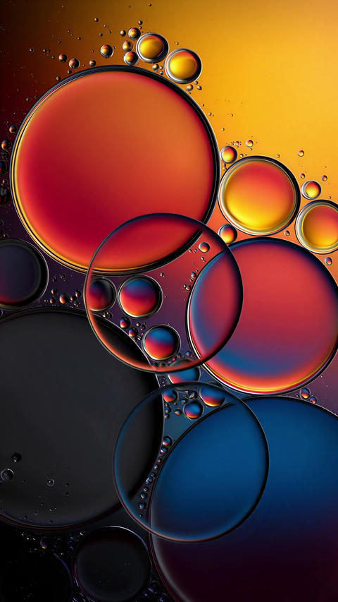 Colorful abstract oil bubbles floating on water