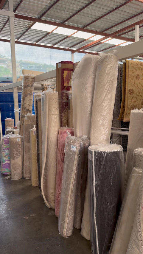 Rolled mattresses stored in a showroom