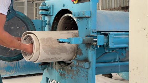Worker repairing a large industrial machine
