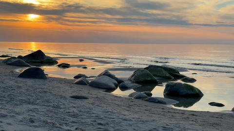 Rocky beach coastline on Ruegen island in Germany during sunset over the Baltic