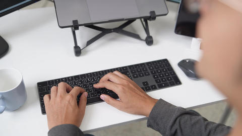 Close Up of Hands Typing on Keyboard for Remote Working Environment Using