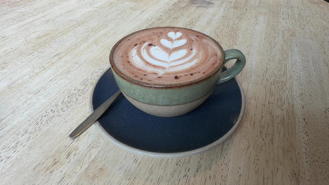Delicious hot chocolate in cute ceramic cup with ornament on top