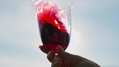 Red Wine Glowing in Sunlight Celebrating Vineyard Harvest Tradition. Local winemaking