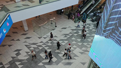 High angle view of shoppers walking in a contemporary mall
