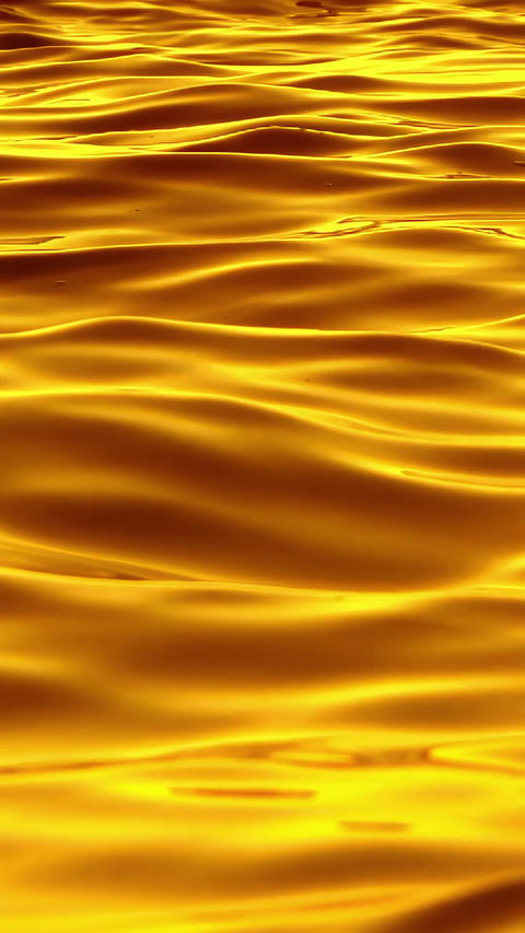 The golden waves of the ocean, with a texture like liquid gold