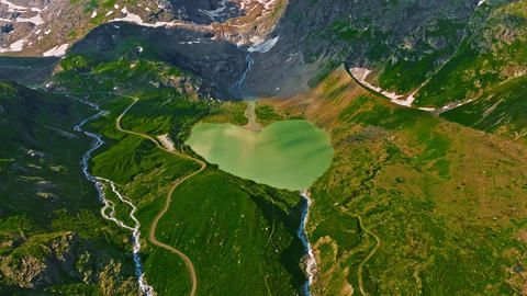 Establishing shot of Switzerland. Aerial view of the green meadows of